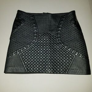 Black leatherette textured mini skirt by H&M. Sz 8